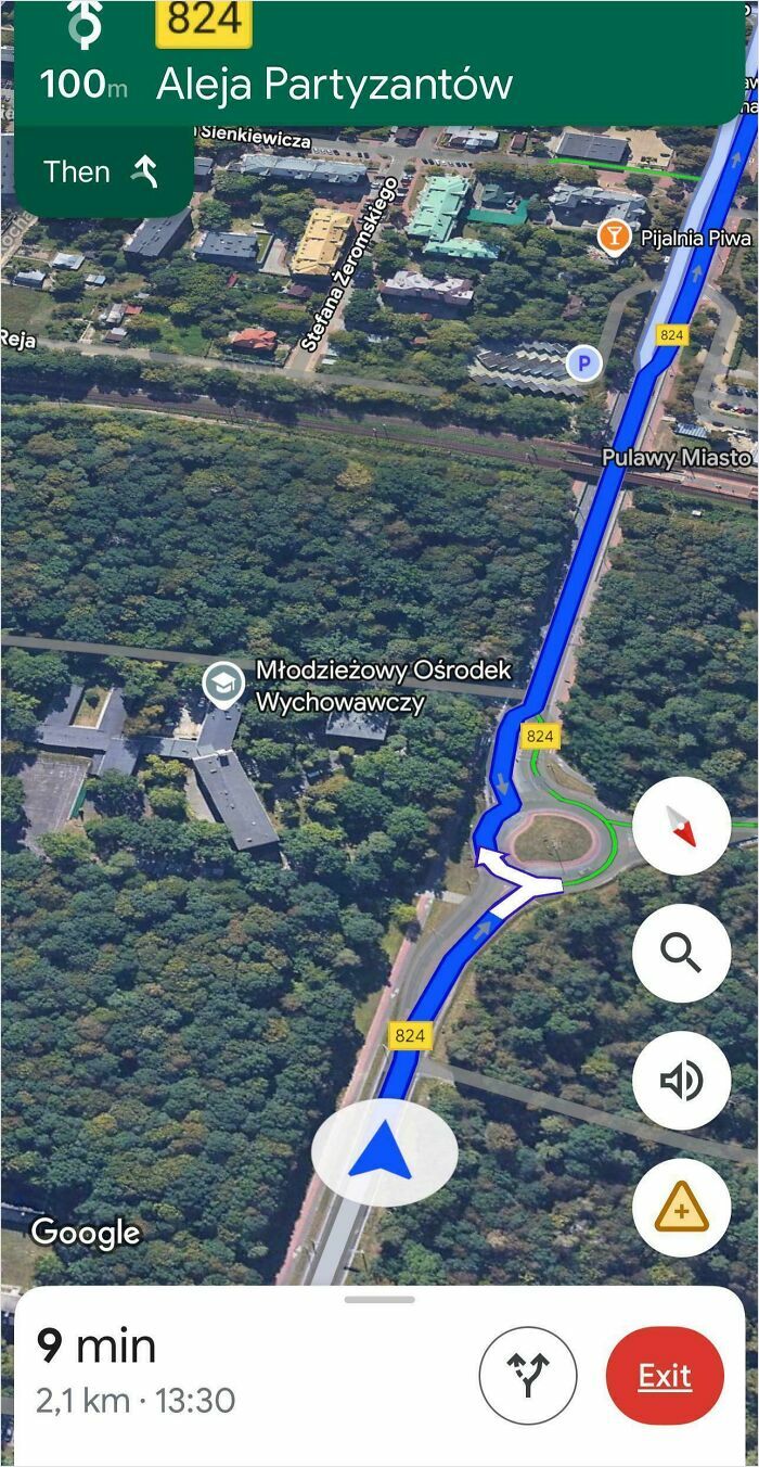 Google Maps navigation showing Aleja Partyzantow route and surrounding forest area