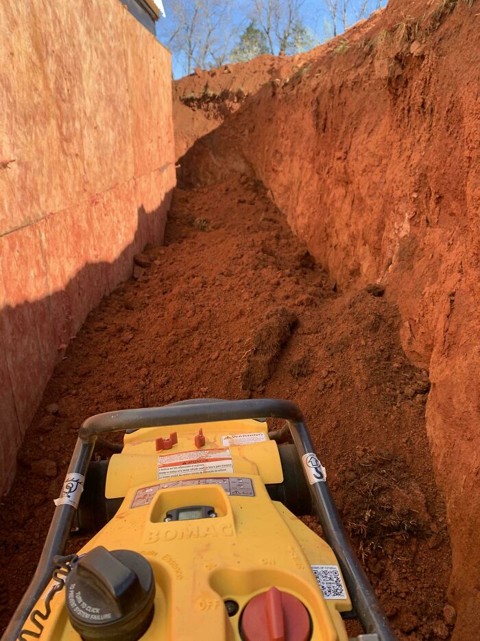Close-up of dark debris inside confined space related to risky survival scenarios