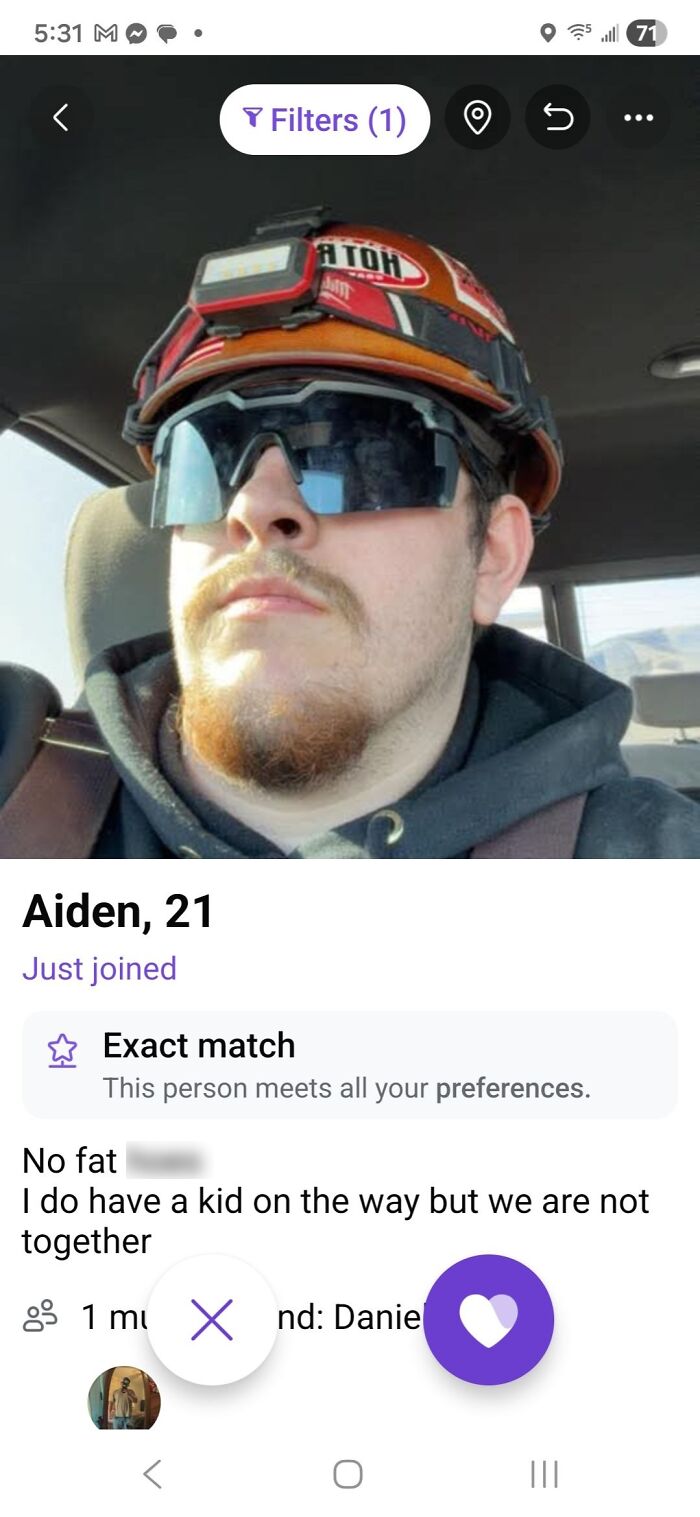 Dating profile of Aiden, 21, wearing a construction helmet and sunglasses