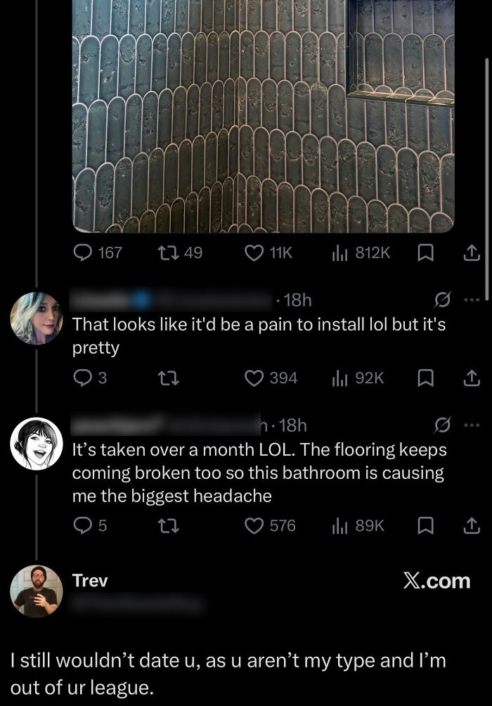 Close-up of unique black tile flooring with scalloped patterns causing installation issues