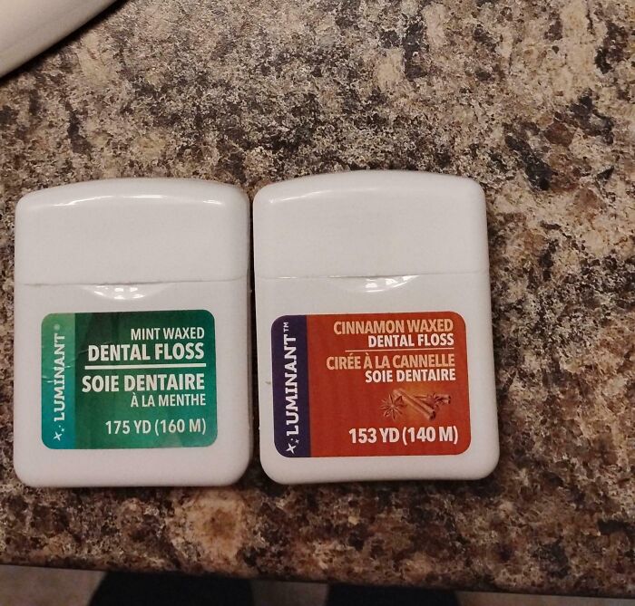 Two Luminant dental floss containers with different yard lengths shown