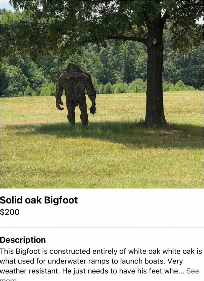 Solid oak Bigfoot sculpture made of white oak in a grassy field