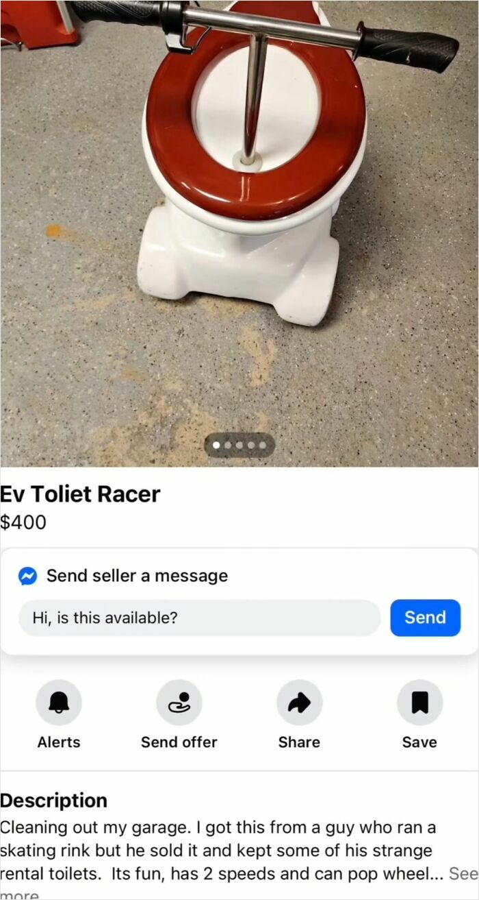 Electric toilet racer with red seat and handlebars on grey floor
