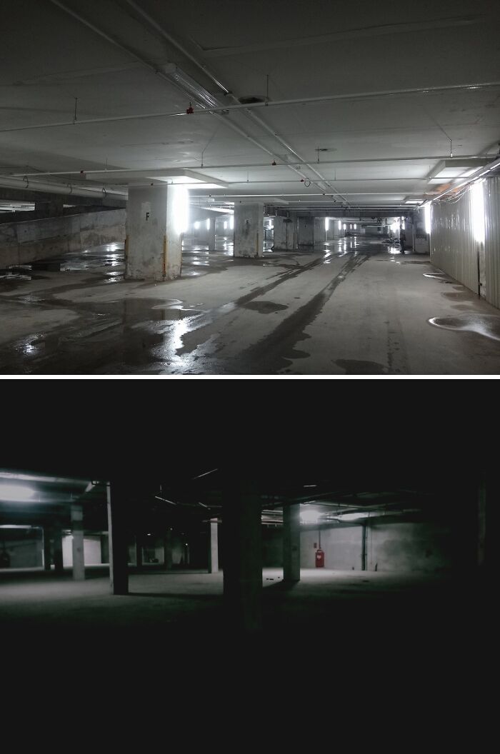 Dimly lit empty underground parking garage interior with concrete pillars and wet floor