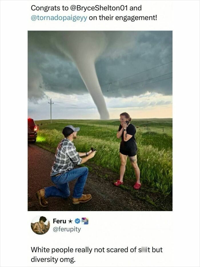 Man proposing to woman in front of a large tornado on a rural road