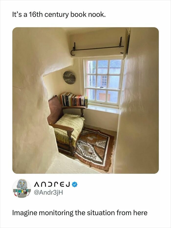 Cozy 16th century book nook with chair and window in small room