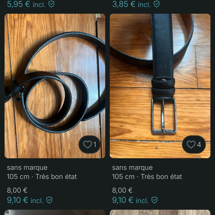 Two black leather belts shown on wooden floor listed on Vinted