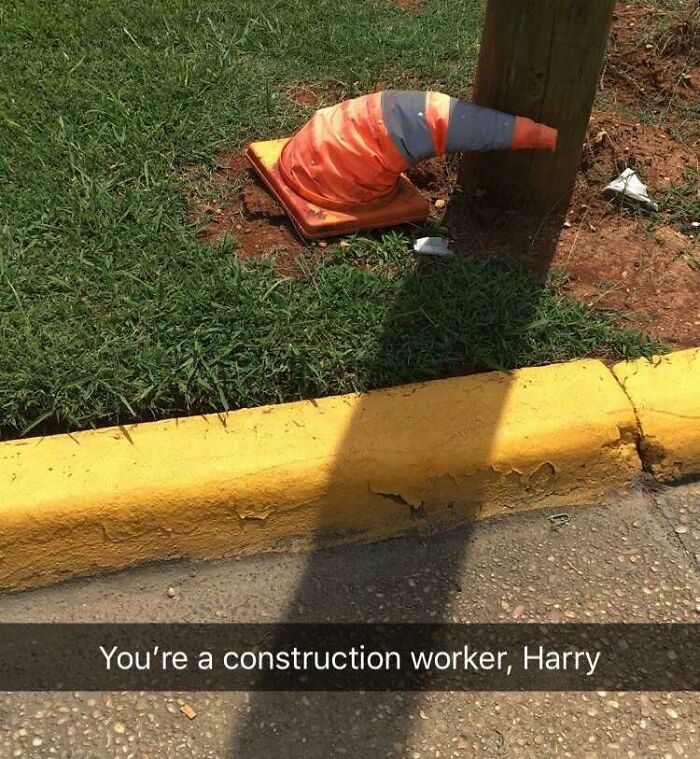 Bent orange construction cone next to pole humor screenshot