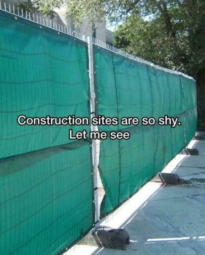 Green construction site fence with gap humor screenshot