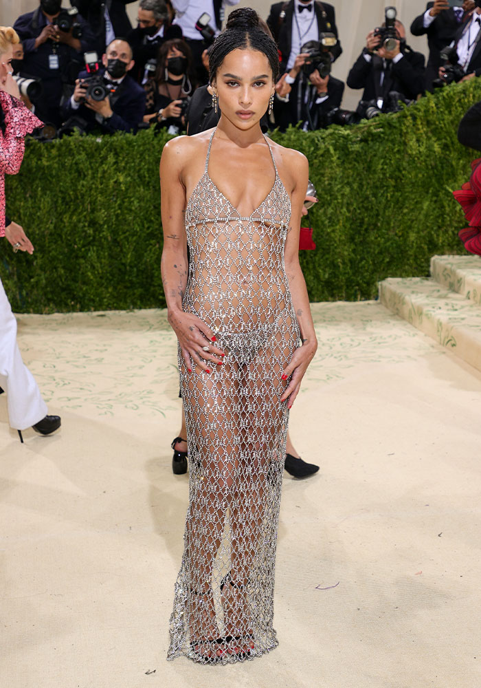 Zoë Kravitz in a dazzling sheer outfit at the Met Gala, standing on a red carpet. Boldest sheer outfits ever.