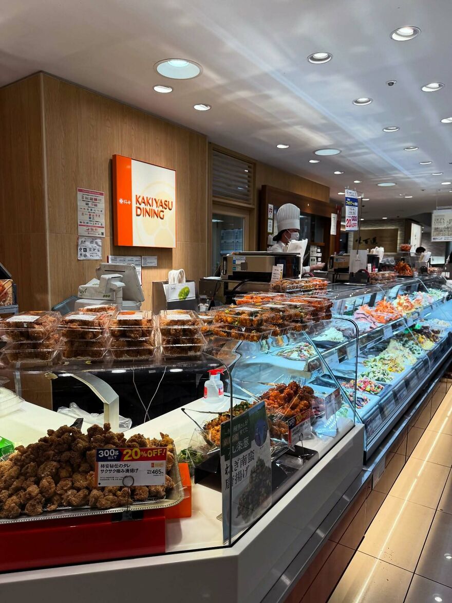 A Japanese food store with various packaged ready-to-eat dishes, showcasing Japanese things and cuisine.