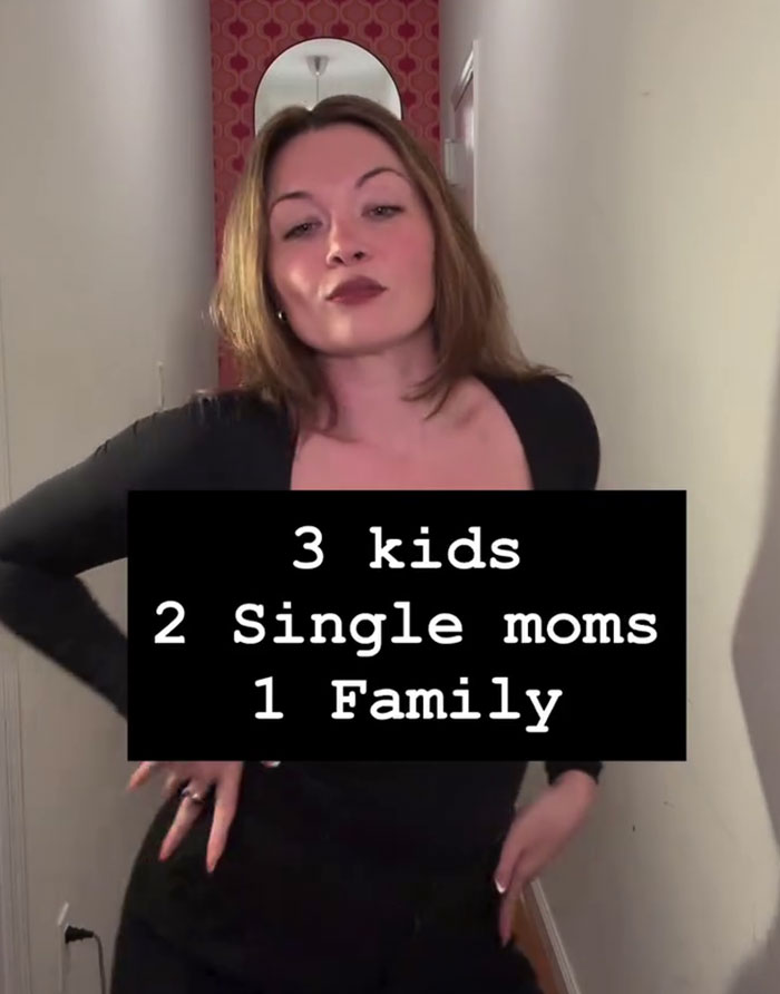 Woman explaining mommune concept with text about three kids two single moms one family Woman explaining mommune concept with text about three kids two single moms one family