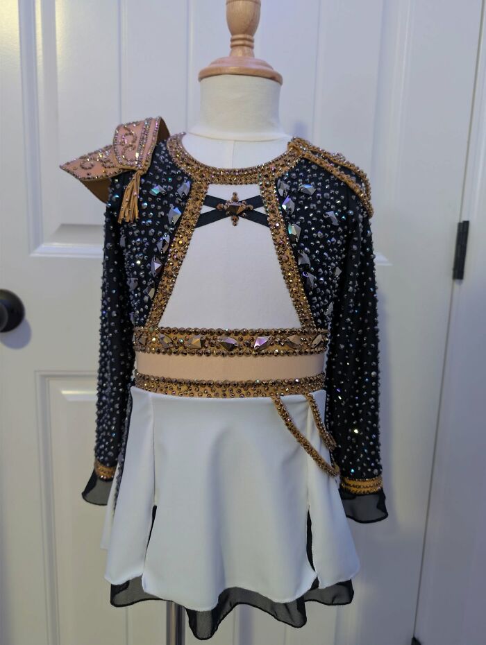 Embellished black and white costume on mannequin