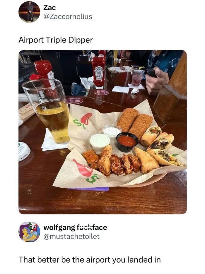 Airport food platter with sauces and beer glass at airport restaurant