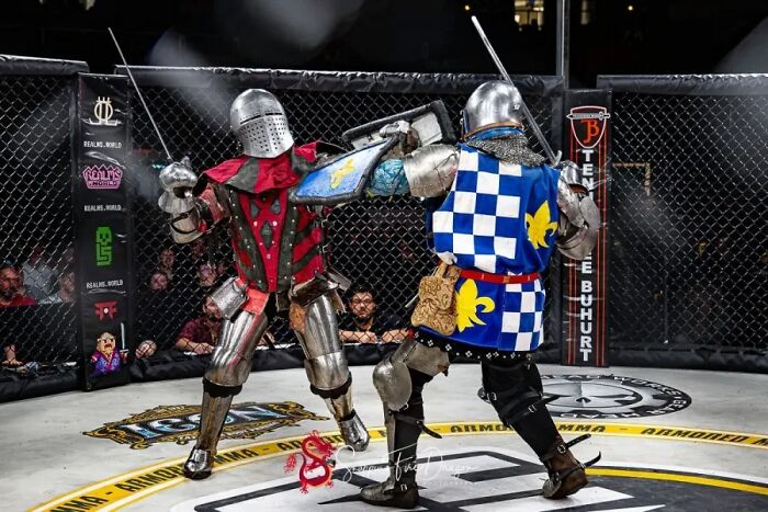 Modern armored knights fighting in a medieval combat sport