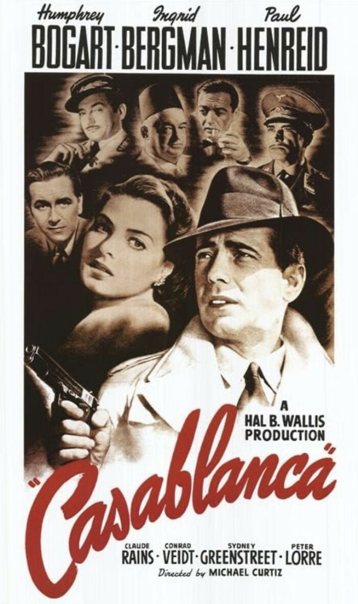 Black and white Casablanca movie poster with Humphrey Bogart holding a gun