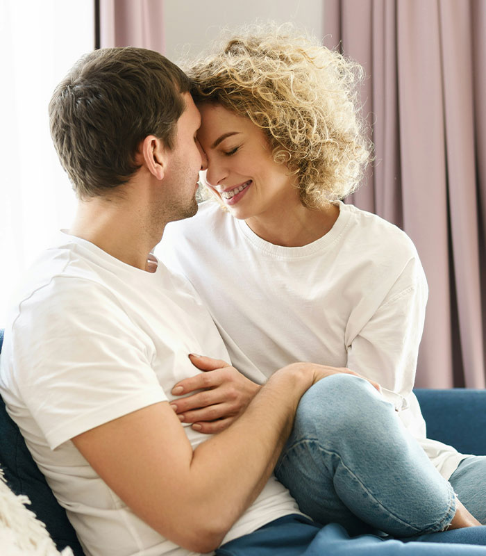 Happy couple embracing closely indoors, relationship theme