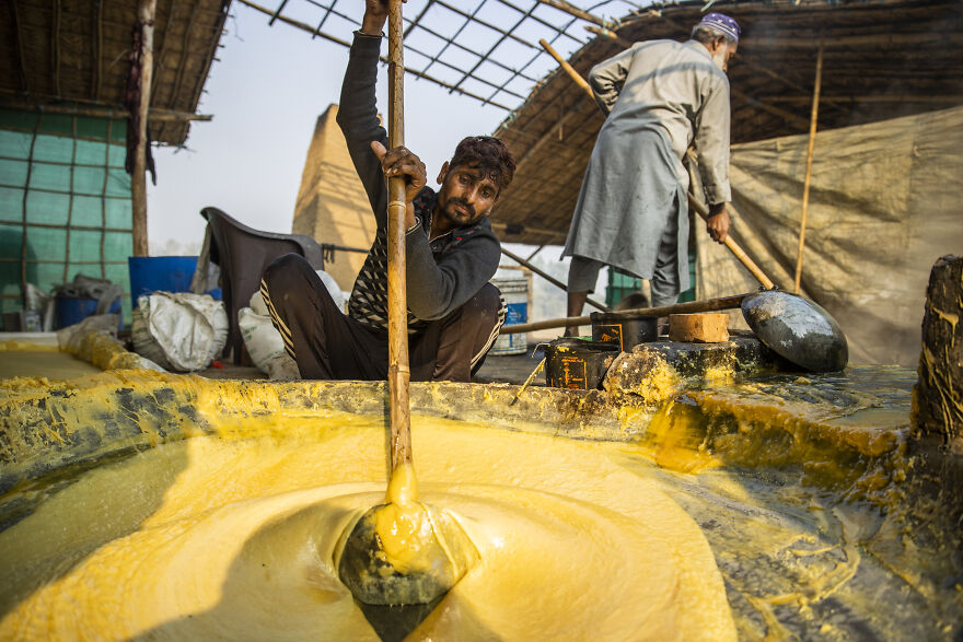 Workers preparing a sugary substance, highlighting global diet quality. This scene reflects common ingredients in countries with the worst diets.
