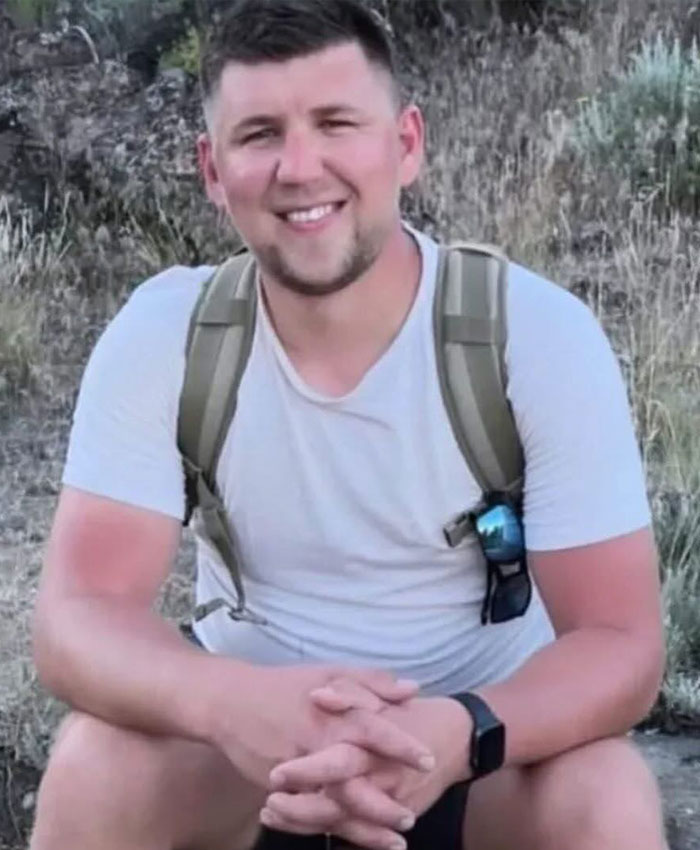Portrait of tourist involved in seal incident sitting outdoors
