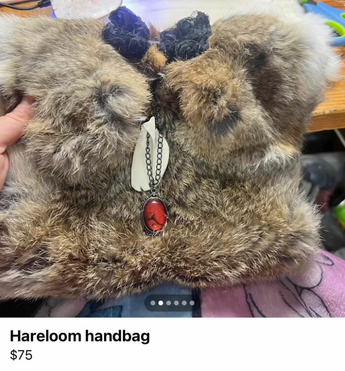 Fur handbag with red pendant necklace accessory