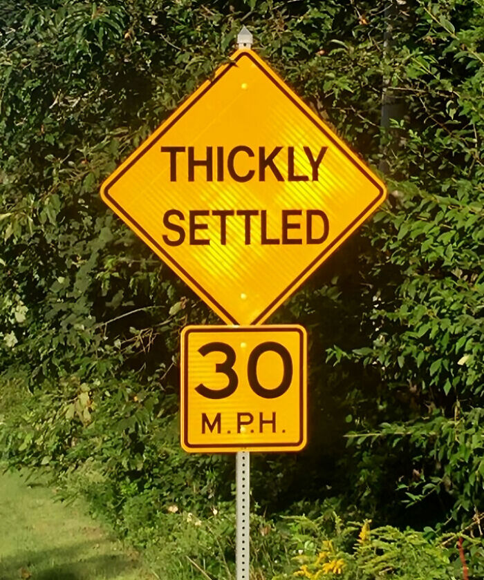 Road sign indicating a thickly settled area with 30 mph speed limit