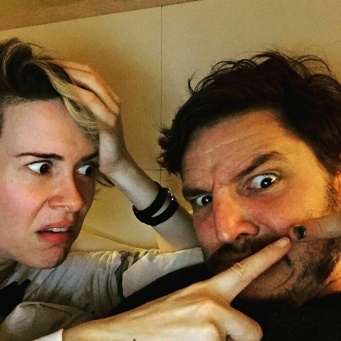 Close-up of two friends making funny faces capturing celebrity friendships