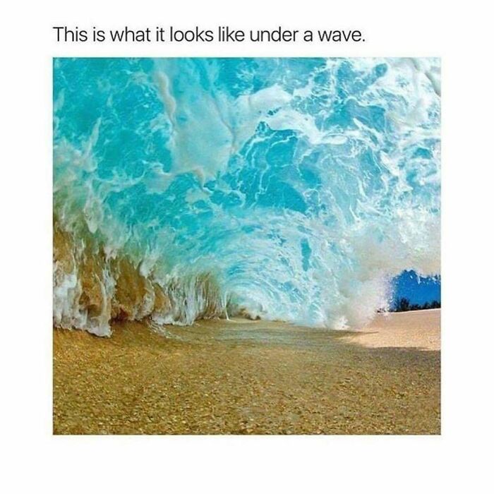 Underwater view of a wave crashing on the beach showing ocean water texture