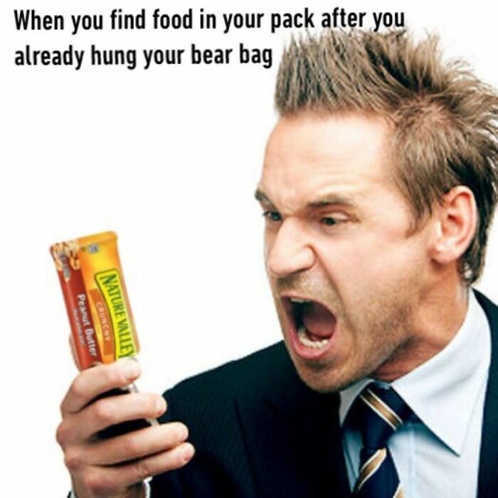 Man angrily reacting to finding food after bear bag already hung on outdoors trip