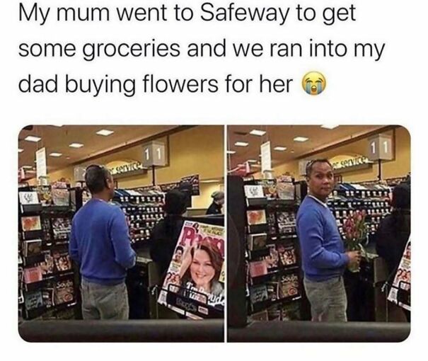 A man in a blue sweater holding flowers at a Safeway checkout, a heartwarming moment that might make your day.