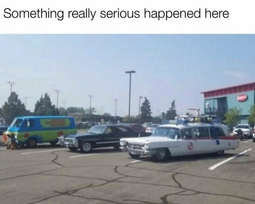 Photo of Mystery Machine, black car, and Ghostbusters car parked together