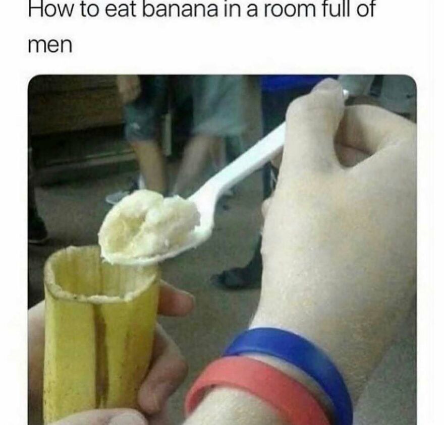 Funny meme about eating banana with a spoon in a room full of men