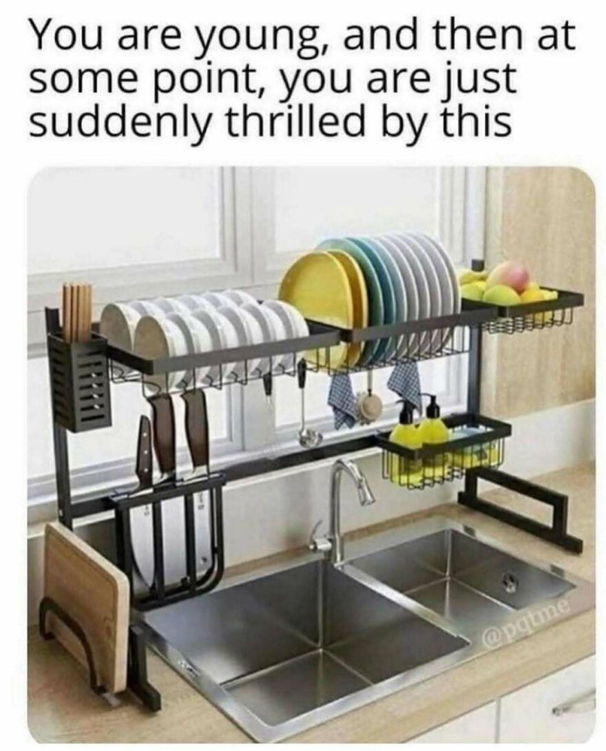 Over sink dish rack with plates, knives, and kitchen utensils for kitchen organization