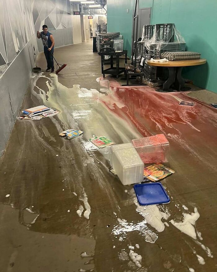 Kitchen fail with spilled liquids and food containers creating a mess on floor