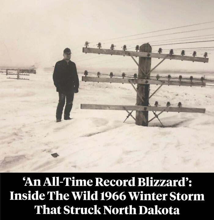 Man standing in deep snow near telephone poles during 1966 North Dakota blizzard
