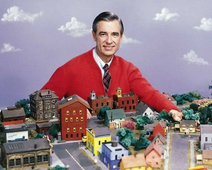 Historic image of Mr. Rogers with model neighborhood setup