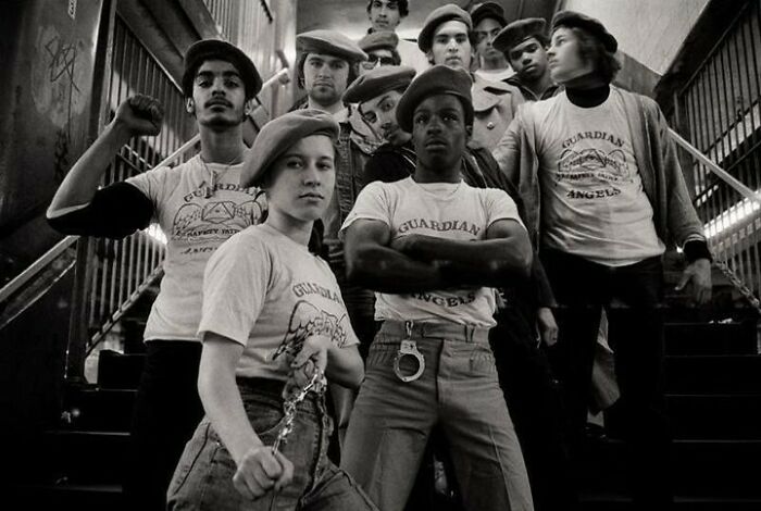 Black and white photo of the Guardian Angels group posing together in uniform