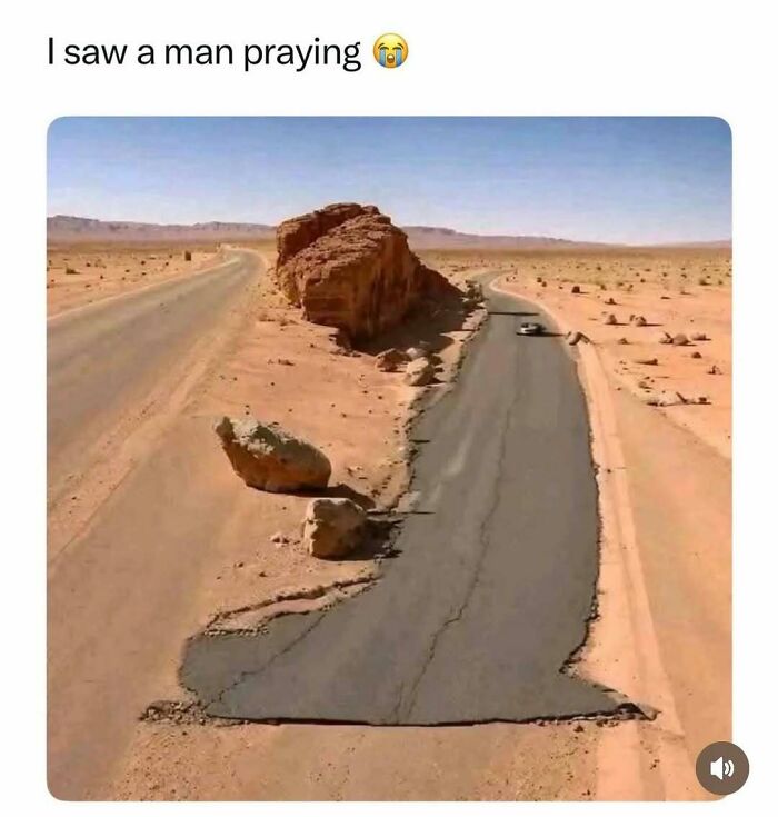 Road patched humorously to look like a praying person in desert