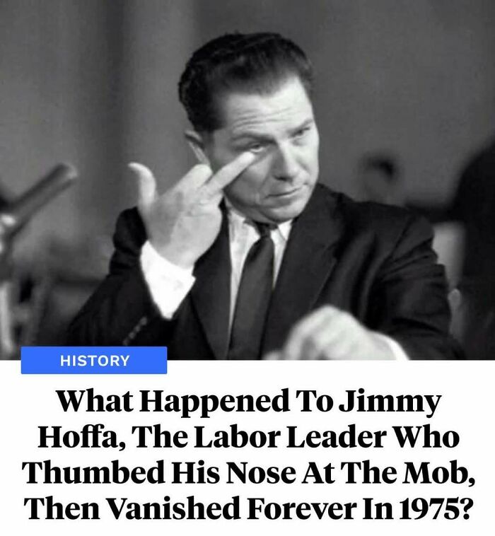 Black and white photo of Jimmy Hoffa making a thumbing nose gesture