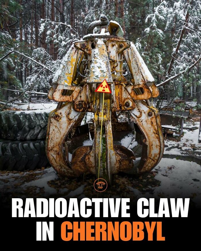 Rusty radioactive claw machinery in Chernobyl covered in snow