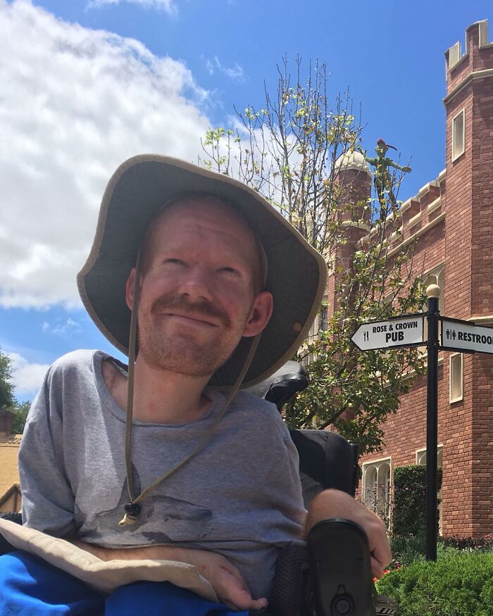 Man in wheelchair with a contemplative expression about challenges and dreams in historical context