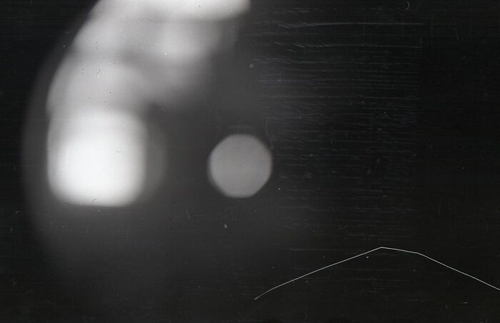 Black and white blurry abstract shapes with faint lines mysterious bench photo