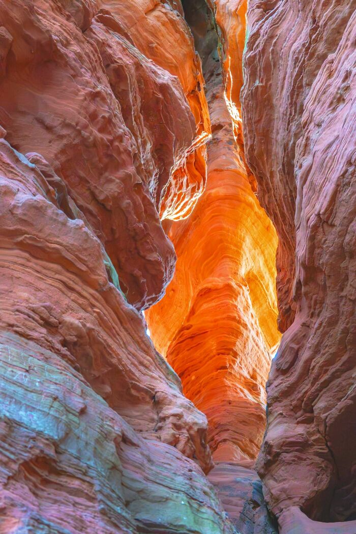 Vivid orange narrow canyon with stunning rock formations view