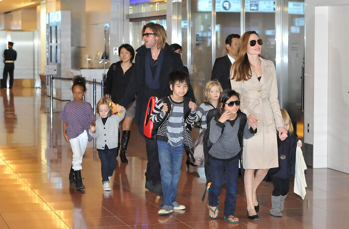 Angelina Jolie, Brad Pitt, and their children walk together, holding hands. This family moment relates to Angelina Jolie emails. Angelina Jolie, Brad Pitt, and their children walk together, holding hands. This family moment relates to Angelina Jolie emails.