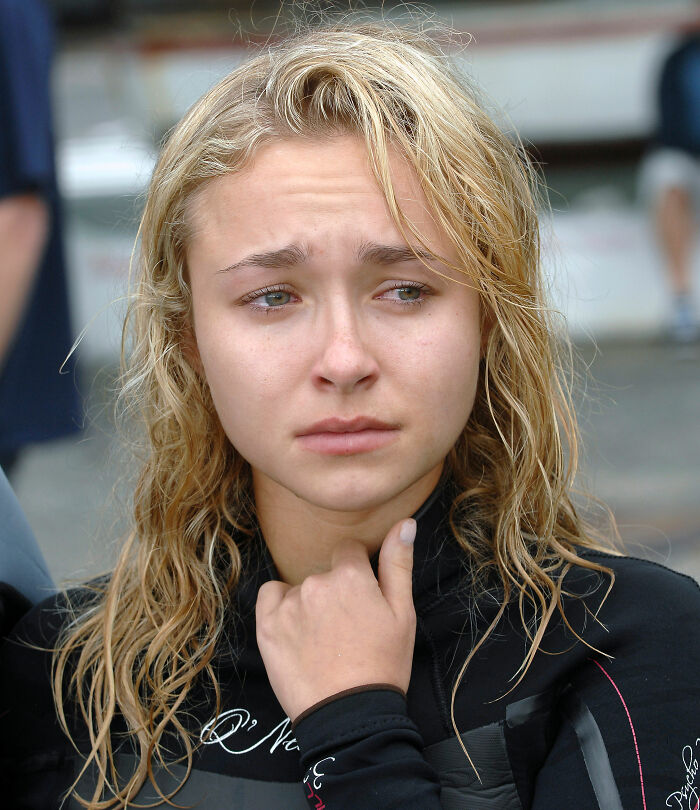 Hayden Panettiere looking emotional outdoors with wet hair