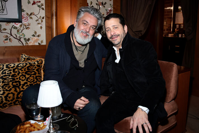 Two men sitting together in a cozy room with warm lighting for Mobland drama discussion Two men sitting together in a cozy room with warm lighting for Mobland drama discussion