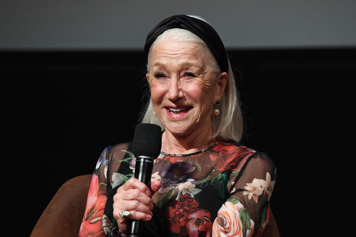 Helen Mirren speaking into a microphone at an event about Mobland drama Helen Mirren speaking into a microphone at an event about Mobland drama