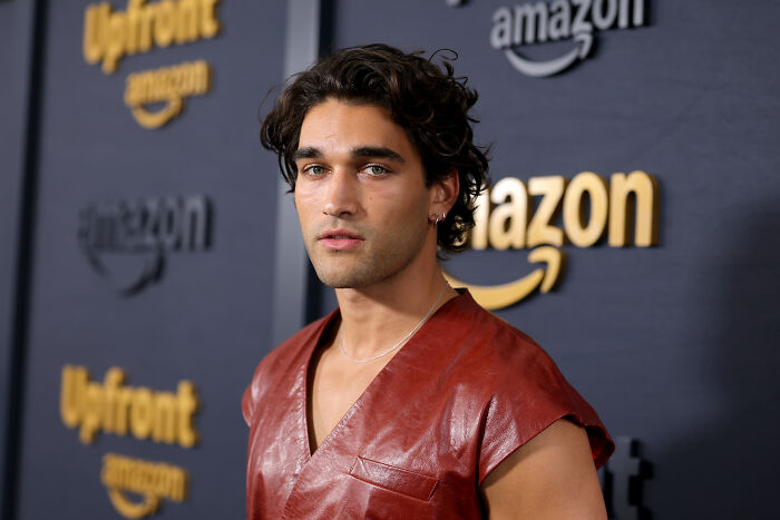 Off Campus star posing at Amazon event in leather outfit Off Campus star posing at Amazon event in leather outfit