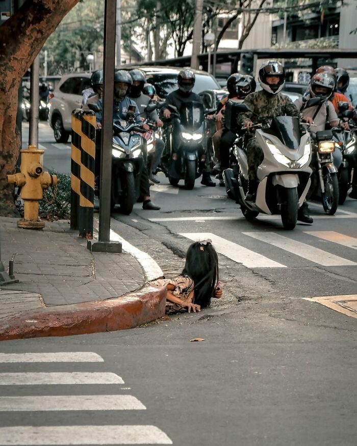 Photo of a woman emerging from a drain highlighting horrifying historical facts about underground living groups