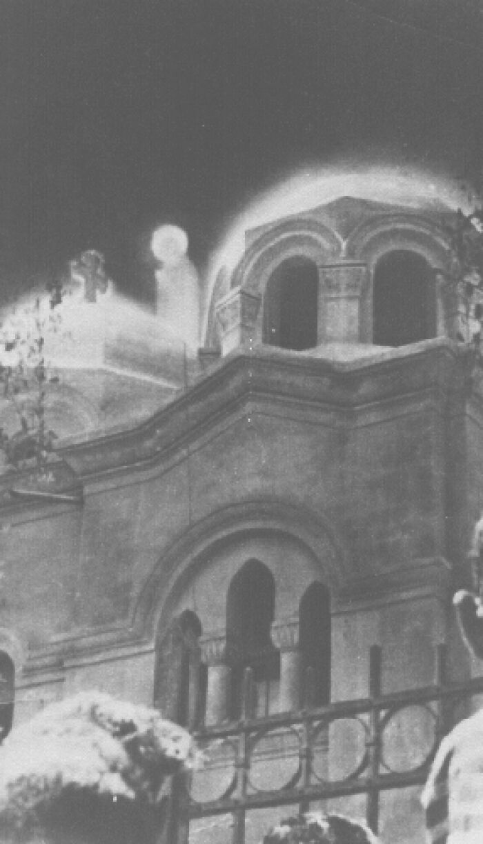 Haunted architecture with unexplained glowing orbs around the building