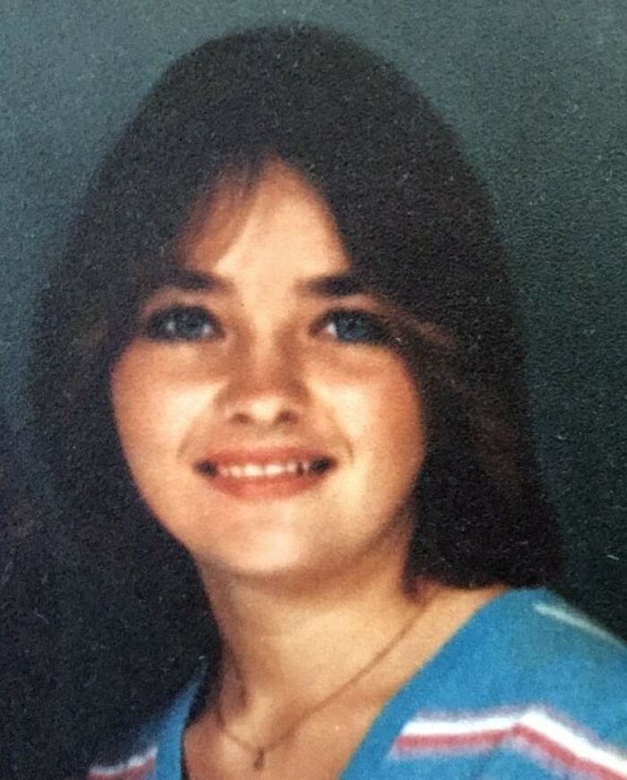 Close-up of young woman smiling with dark hair for creepy strange cases